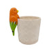 Decorative planter with a parrot figurine on a white background