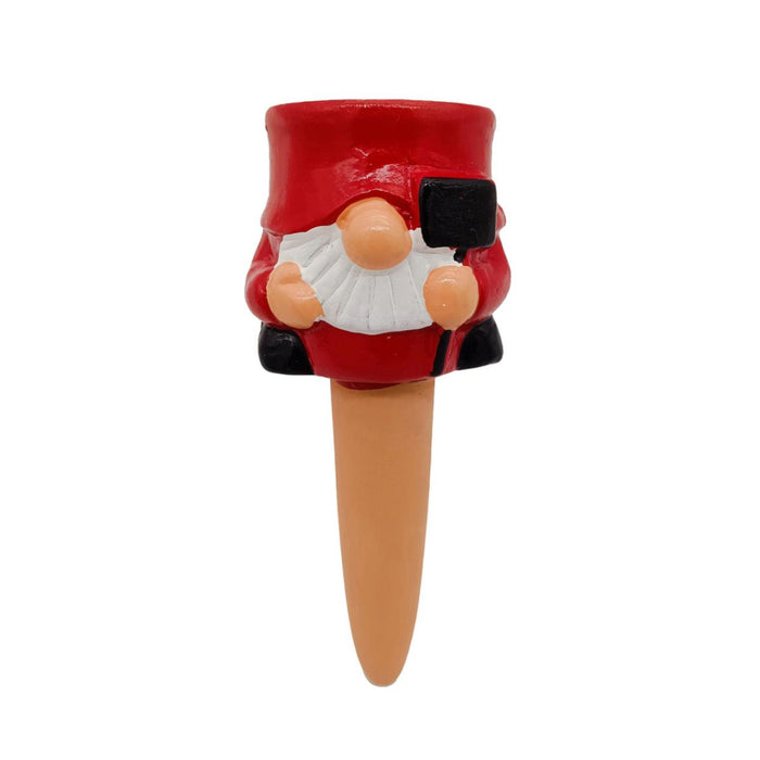 Gnome-shaped plant stake with a red hat on a white background
