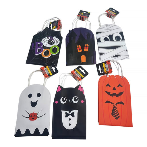 Six Halloween-themed paper treat bags arranged on a white background, each with a different spooky design: spider, haunted house, mummy, ghost, cat in a tuxedo, and jack-o'-lantern.