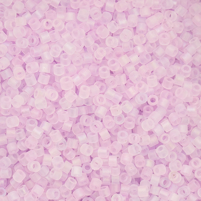 Close-up of small purple beads on a light purple background