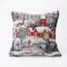 A square decorative throw pillow featuring a detailed winter village scene with red houses, snow-covered roofs, bare trees, and small figures in red clothing, shown against a plain white background.