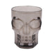 A translucent smoky gray plastic cup shaped like a skull, shown on a plain white background.