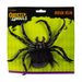 A packaged Halloween decoration featuring a large black spider with hairy legs and red eyes on a bright lime green card backing. The packaging reads 'Ghastly Ghouls' and 'Devilish Décor'.