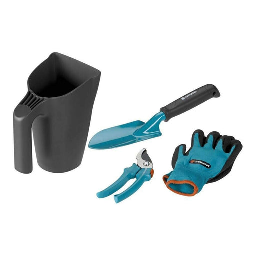 Gardening tool set with black container, blue trowel, pruner, and gloves on a white background