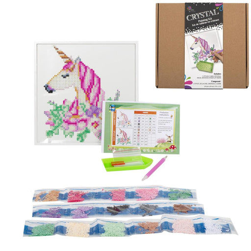 Cross-stitching kit with unicorn design, materials, and packaging on a white background