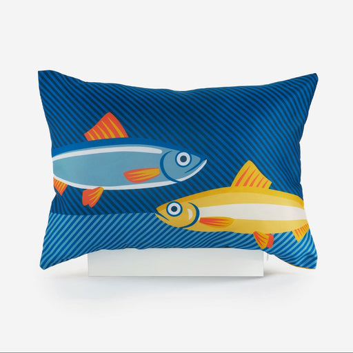Decorative pillow with fish design on a blue background