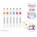 Six Color Factory alcohol-based markers in assorted colors shown upright, with a package of the markers and two circular inset callouts demonstrating marker tip use on fabric and a sewing machine.