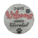 Decorative stone with 'Dogs Welcome, Humans Tolerated' text and paw prints on a white background
