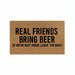 Doormat with humorous text 'Real friends bring beer (if we're not home, leave the beer)' on a brown background