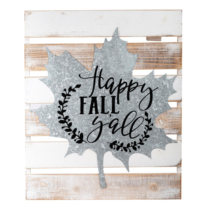 Galvanized metal fall leaf wall decor with 'Happy Fall J'all' lettering and a leaf wreath design, mounted on a rustic white and brown wooden plank background.