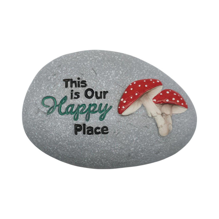 Decorative stone with mushrooms and text 'This is Our Happy Place' on a white background
