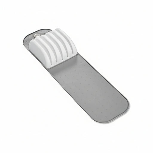 Gray bath mat with white suction cups on a white background