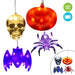 Four LED hanging Halloween decorations on a white background: a gold skull, an orange jack-o'-lantern, a purple spider, and a purple bat. Two circular icons in the top right indicate LED light and battery power, and a small inset at bottom right shows alternate color options.