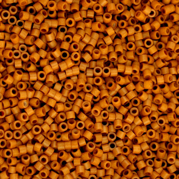 Close-up of a large pile of small, round, orange beads.
