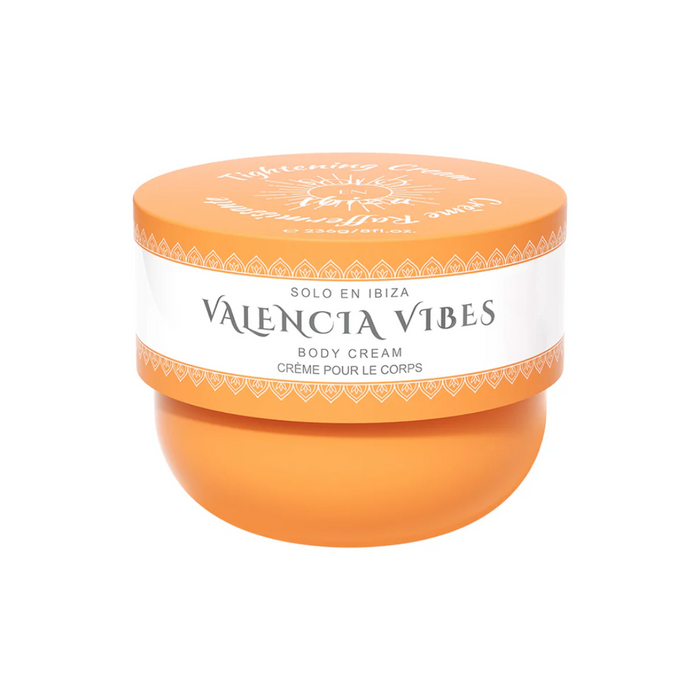 Orange jar of Valencia Vibes body cream on a white background
