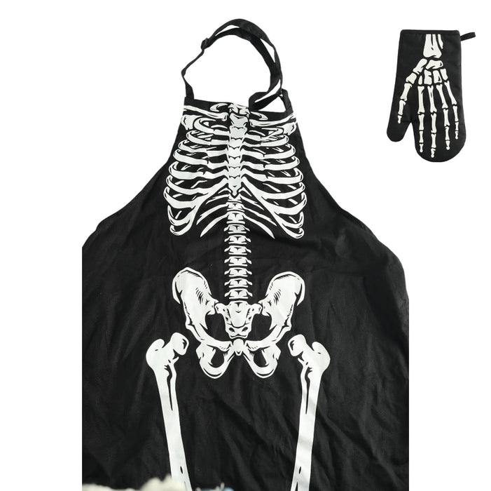 Black apron with a white skeleton rib cage and pelvis print, shown with a matching black oven mitt featuring a skeleton hand graphic on a white background.