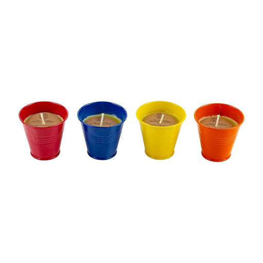 Four colorful metal cups with candles on a white background