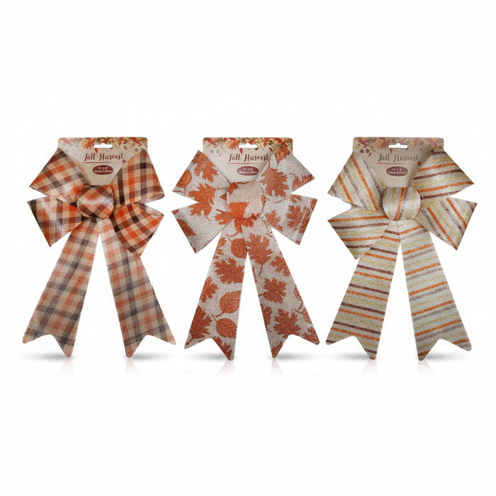 Three autumn-themed fabric bows on a white background, each with a different pattern: plaid, leaf print, and stripes. A black vertical line on the left indicates the height as 14 inches.