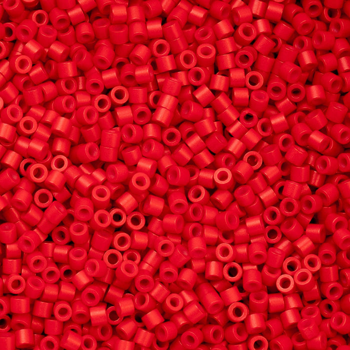Close-up of red plastic beads on a red background