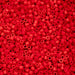 Close-up of red plastic beads on a red background