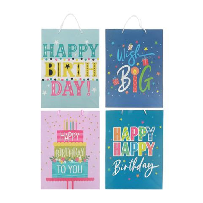 Four colorful birthday gift bags arranged in a 2x2 grid on a white background. The bags feature playful text and illustrations including 'HAPPY BIRTH DAY!', 'Wish Big', a birthday cake, and 'HAPPY HAPPY Birthday' in bright pastel and neon colors.