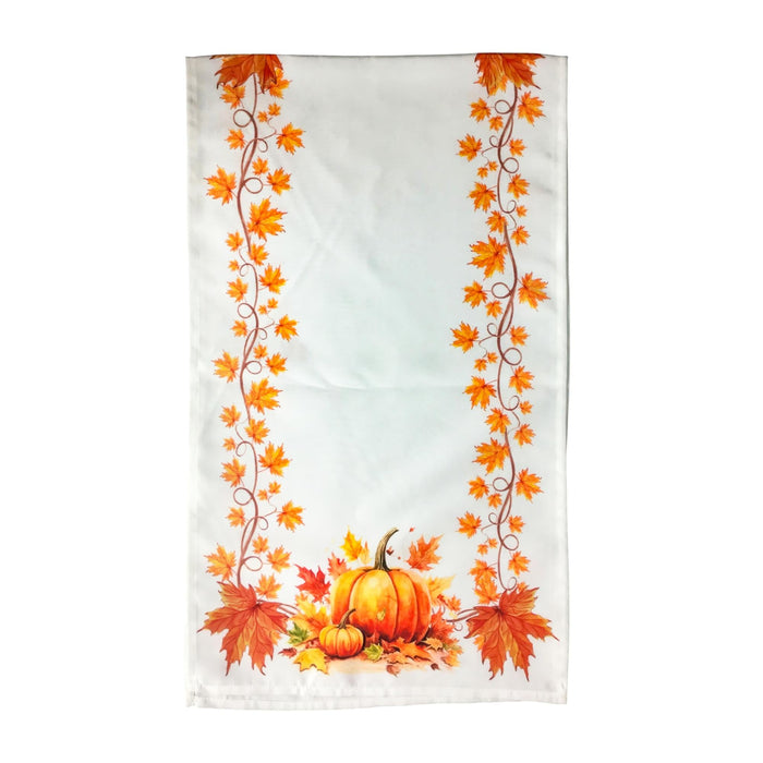 A white kitchen tea towel featuring a festive autumn design with orange maple leaves and pumpkins along the bottom and sides.