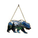 Decorative wall hanging with bear silhouette and mountain landscape design on a white background.