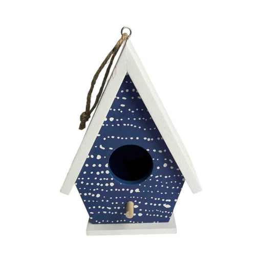 Blue birdhouse with white patterns on a white background