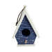 Blue birdhouse with white patterns on a white background